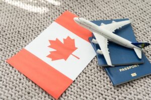 Canada voyages 300x200 - Top,View,Of,Passport,,Toy,Plane,,Flag,Of,Canada